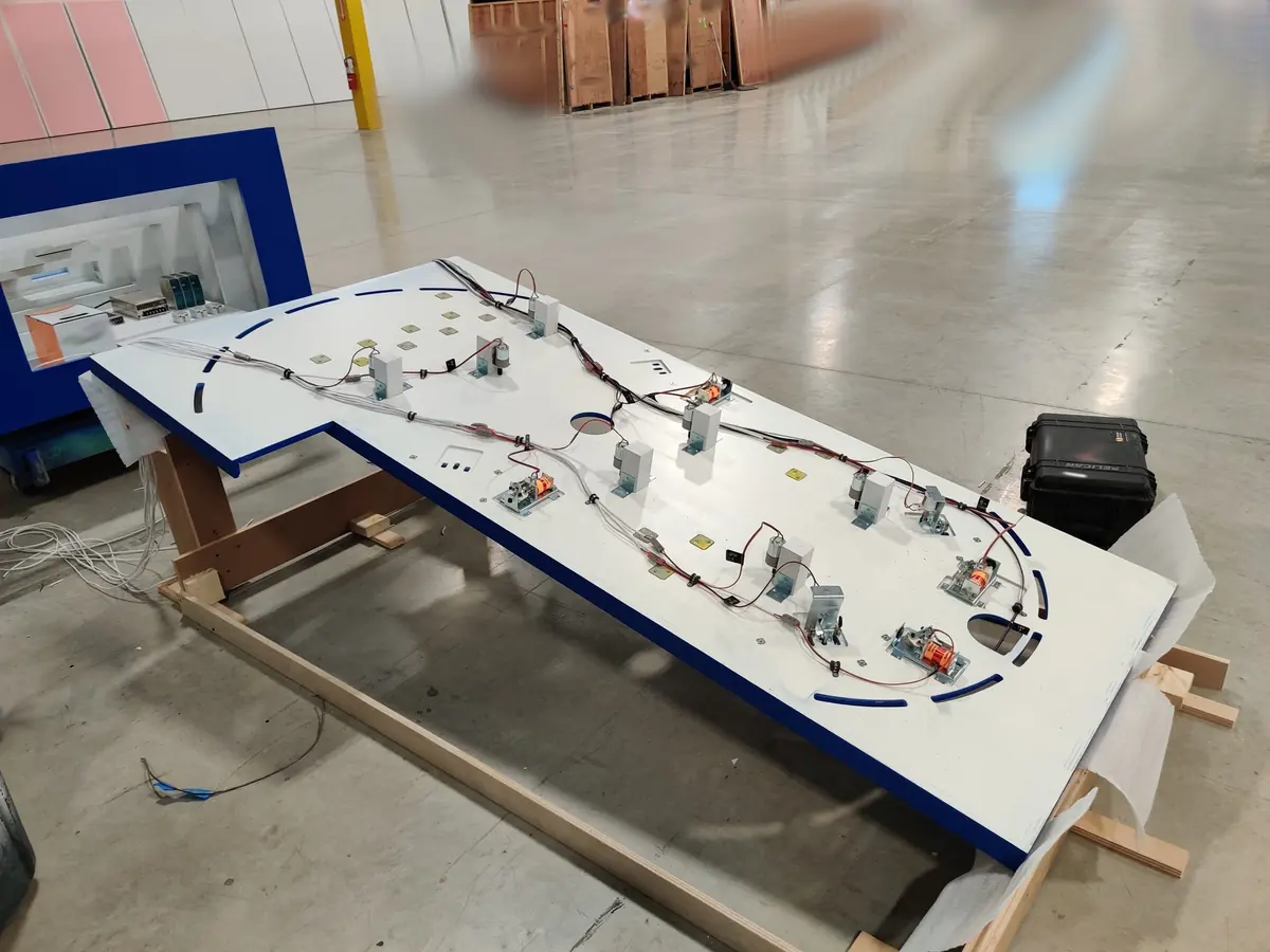 The underside of the playfield with coils, wiring, and spinner motors mounted