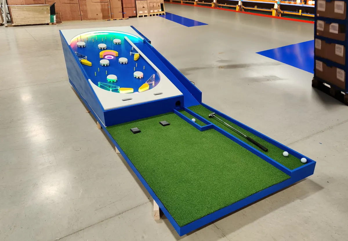 The Pinball Golf prototype: a blue pinball playfield that feeds into a strip of putting green