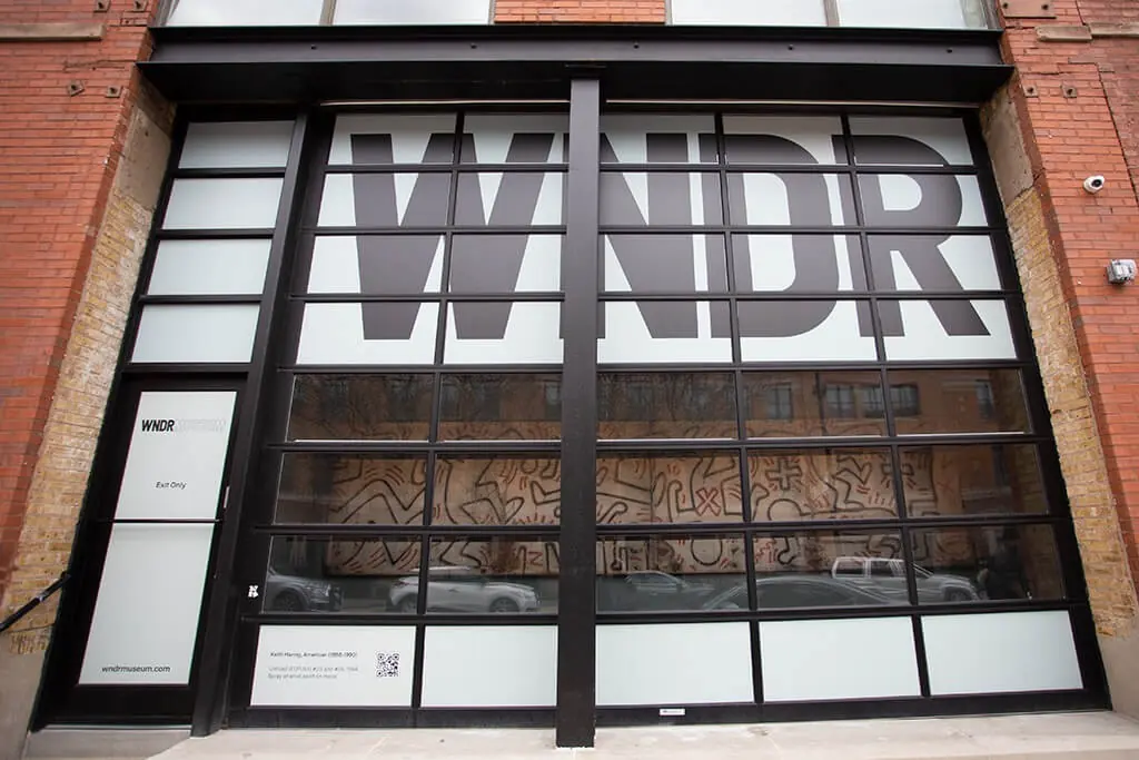 WNDR Museum’s glass garage-door facade with large WNDR lettering